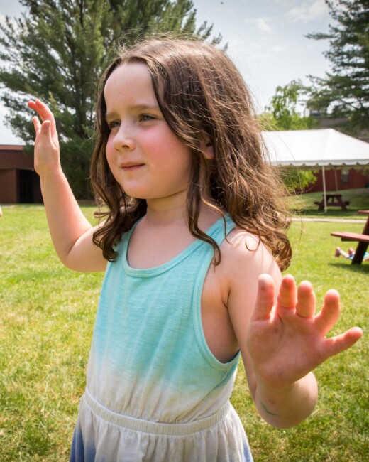 A young girl dancing.