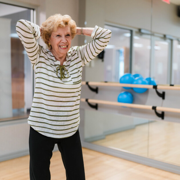 A woman participating in a group fitness program.