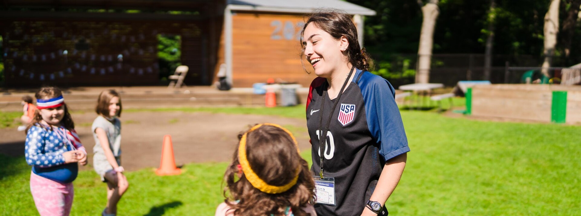 Counselor playing with her campers.