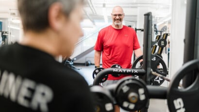 Man working out with personal trainer at the JCC.