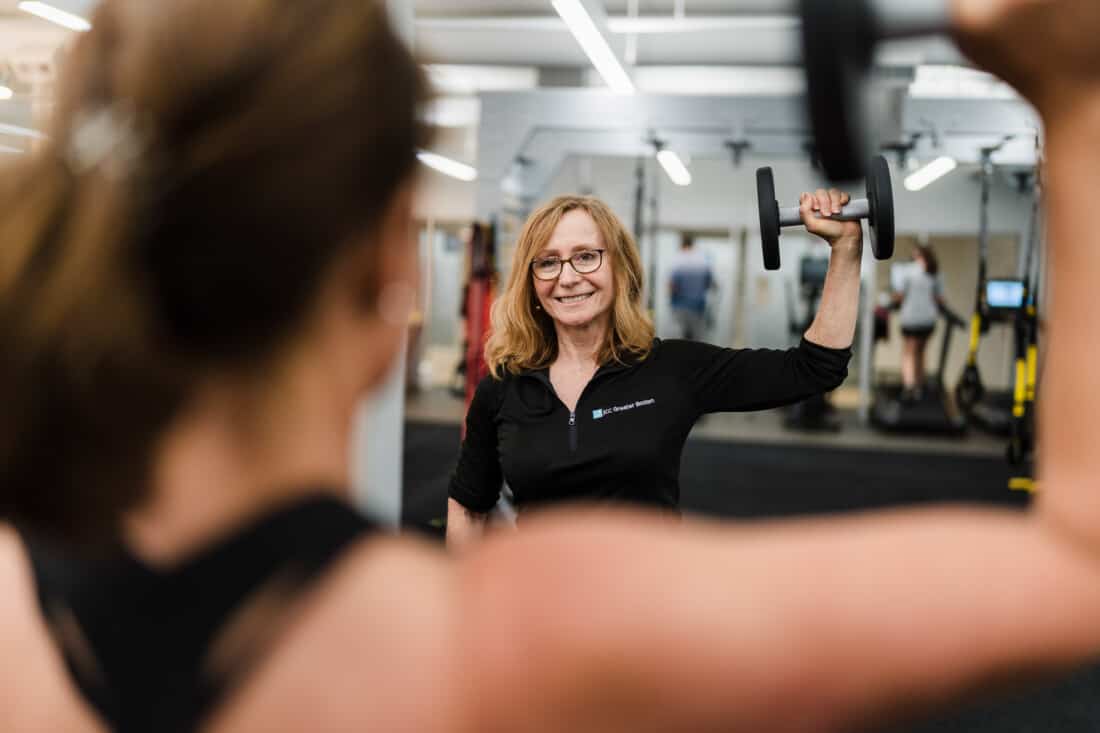 Women holding weights.