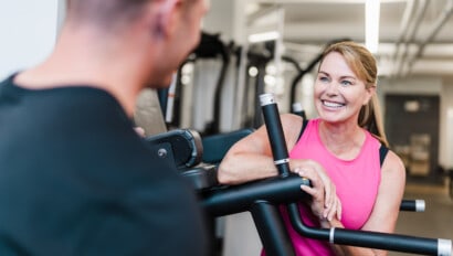 Woman smiling with personal trainer at the JCC.
