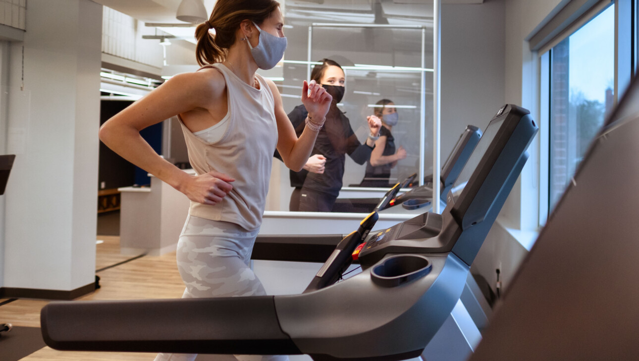 People running on treadmills.