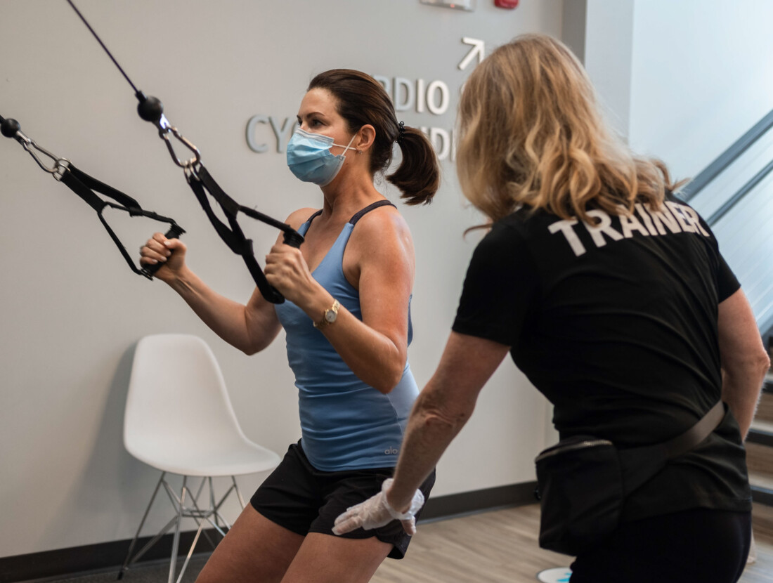 A woman receiving personal training.