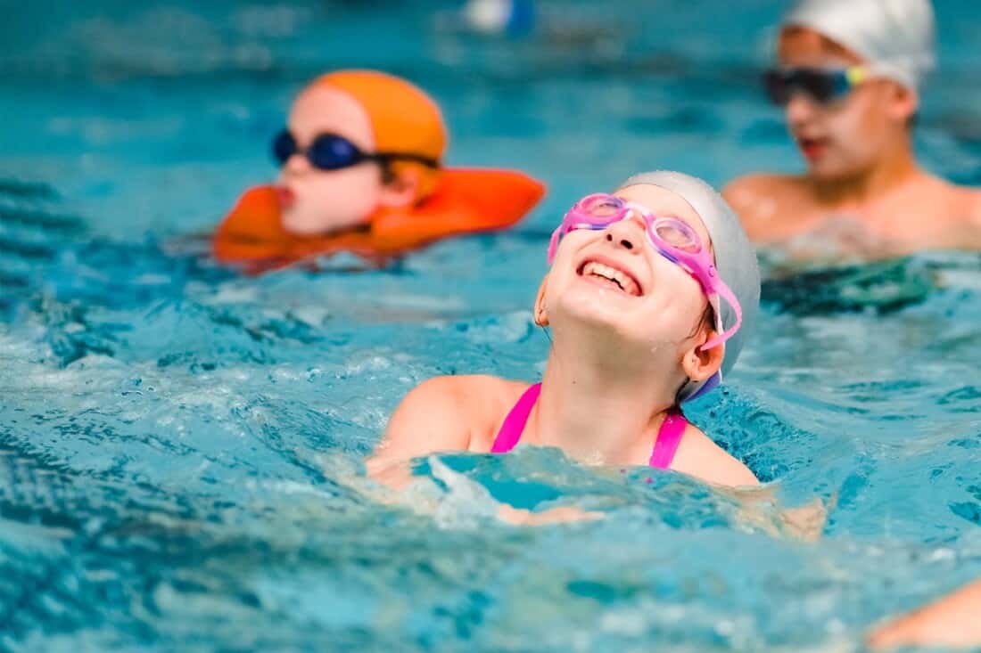 Girl swimming at the JCC Greater Boston indoor pool.