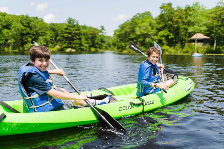 Boys on a kayak at Camp Grossman.