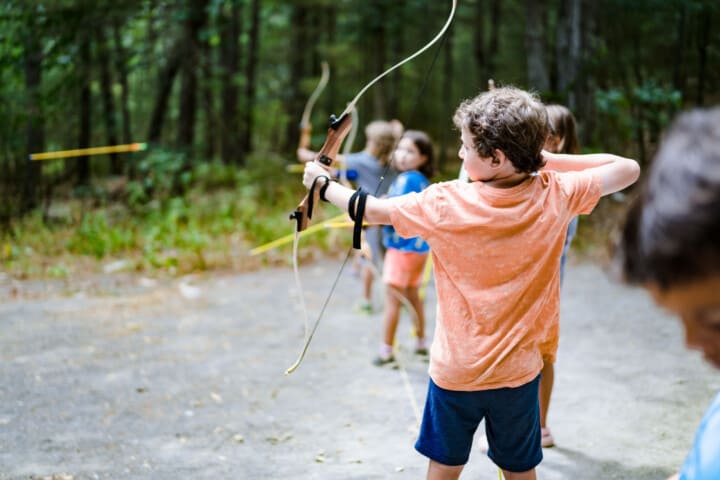 Kids practicing archery at Camp Grossman.