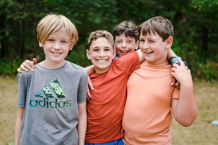 Boys smiling at Camp Grossman.
