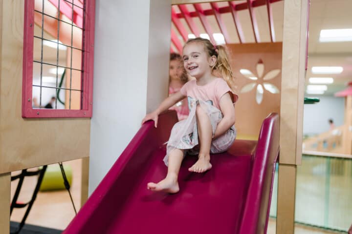 Girl on an indoor slide.