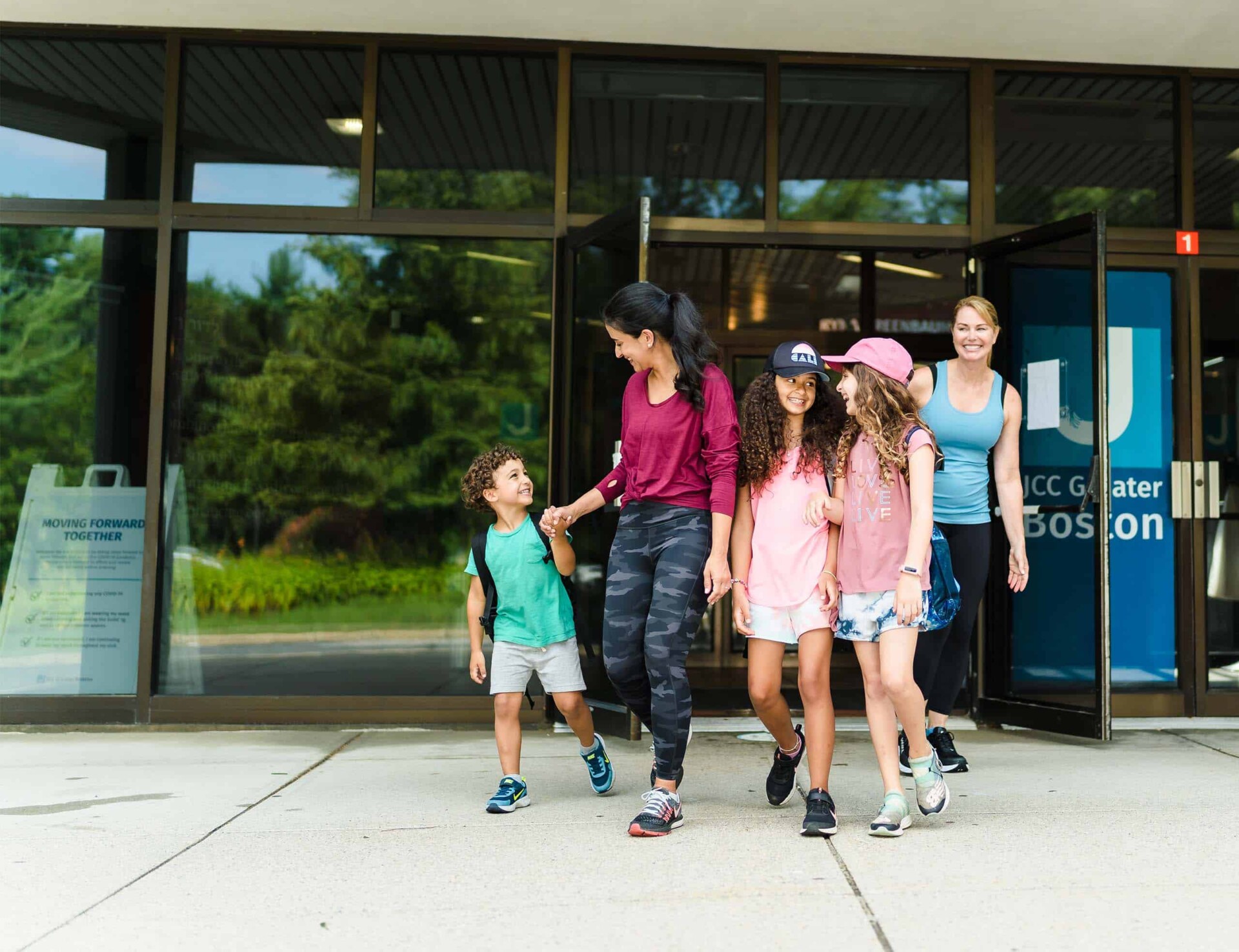 Family walking out of JCC Greater Boston.