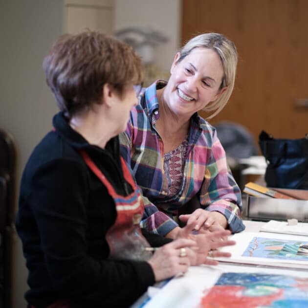 A woman participating in a pastel class.