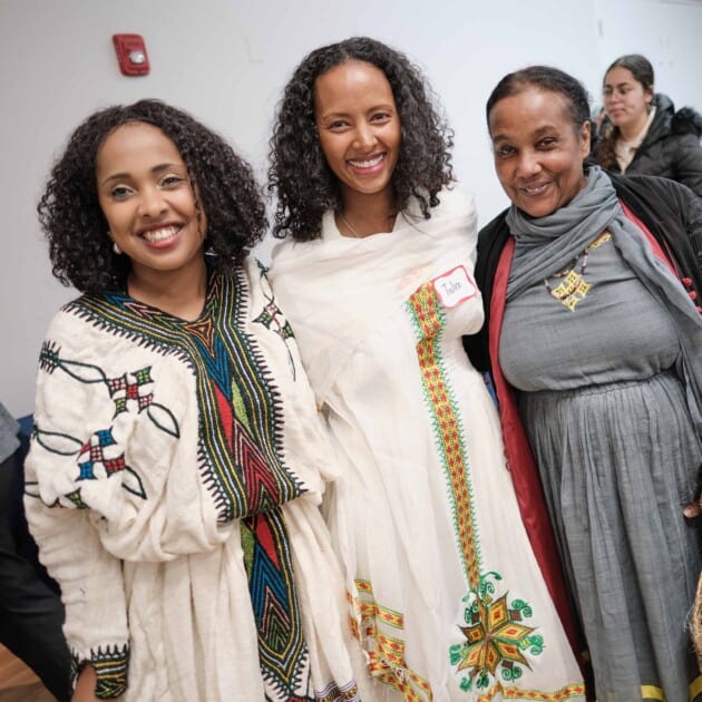 Three woman displaying their rich culture.