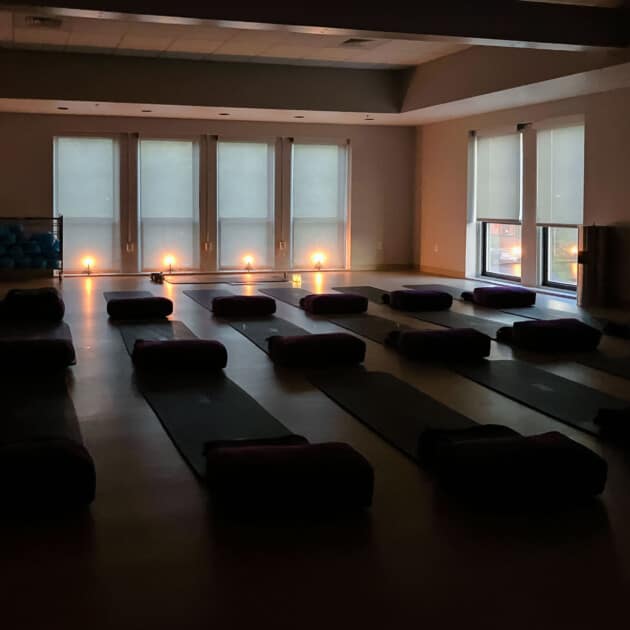 Yoga studio set up with candles.