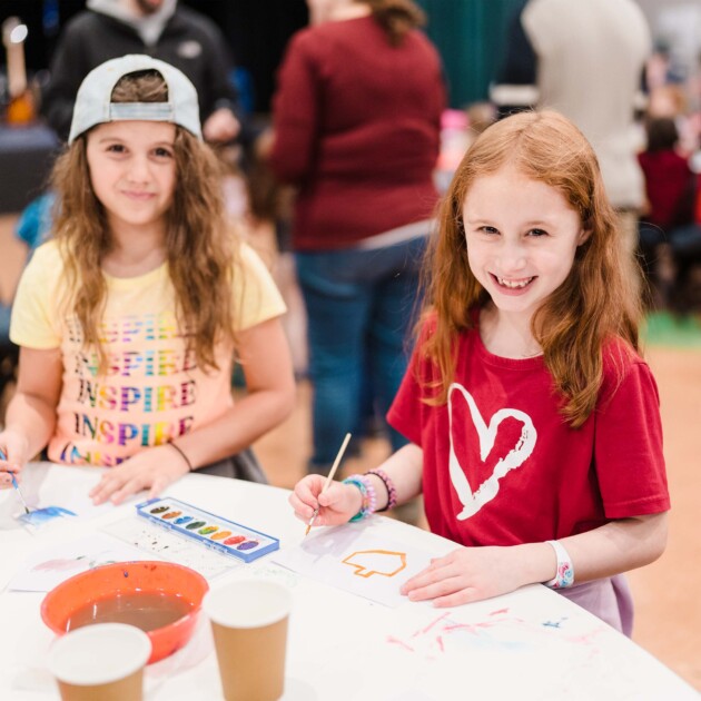 Two girls doing a holiday craft.