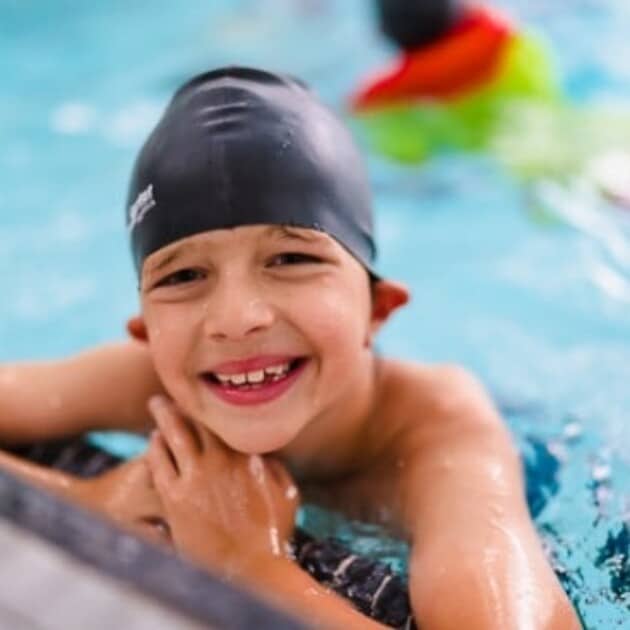 A boy in a swimming pool.