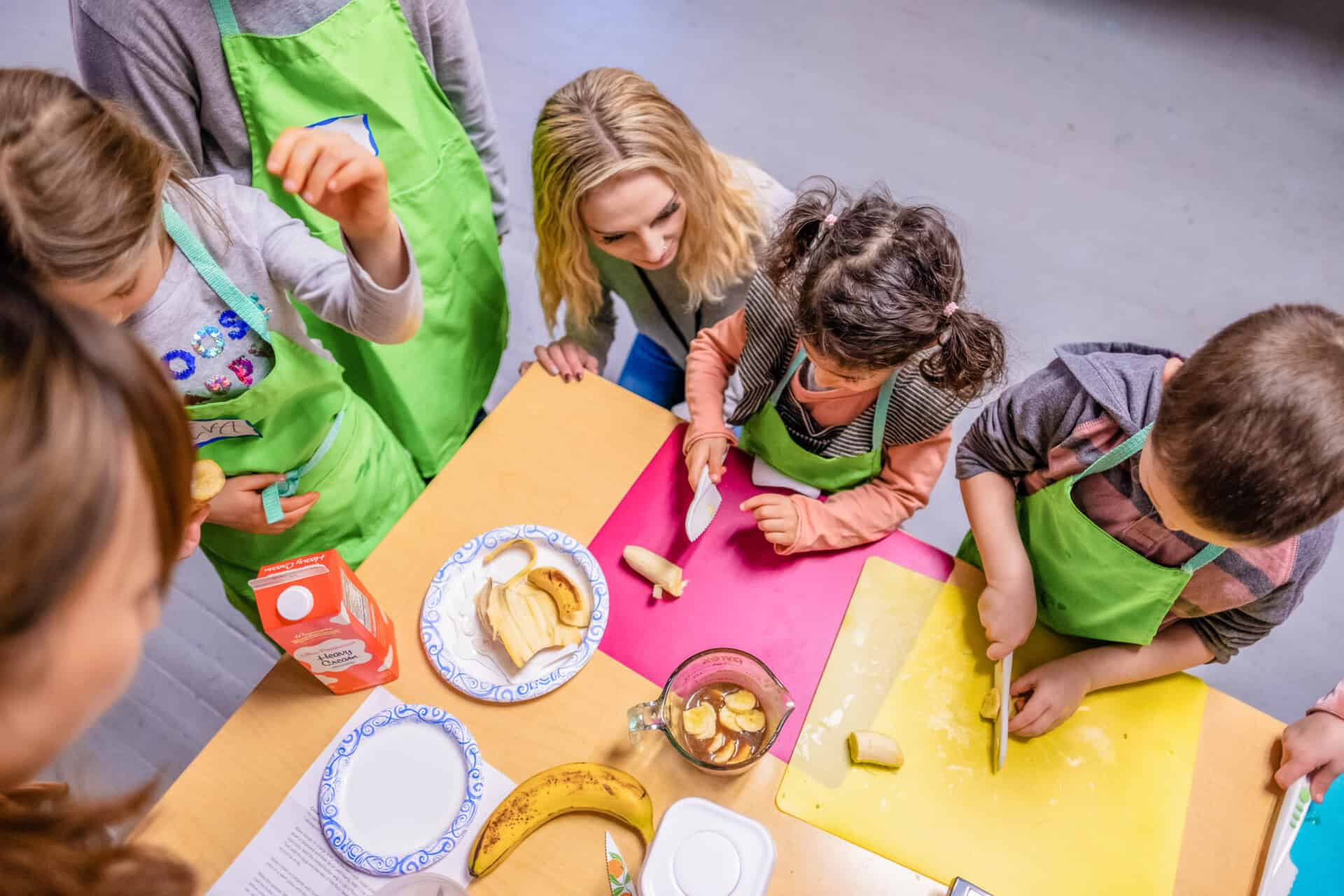 Kids taking a cooking class.