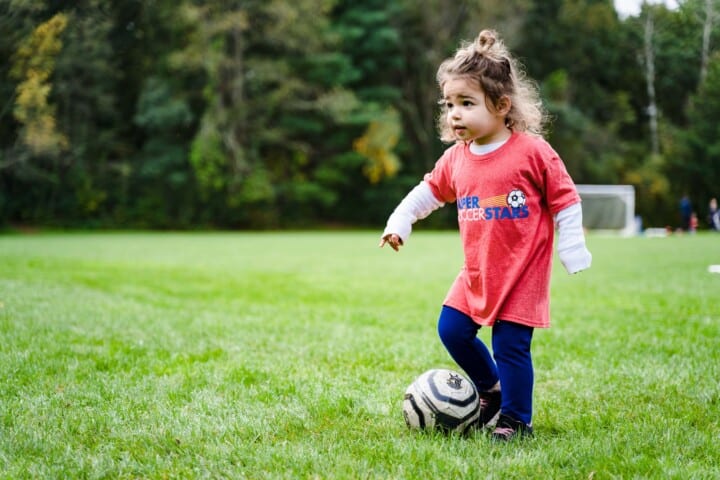 Girl playing soccer.