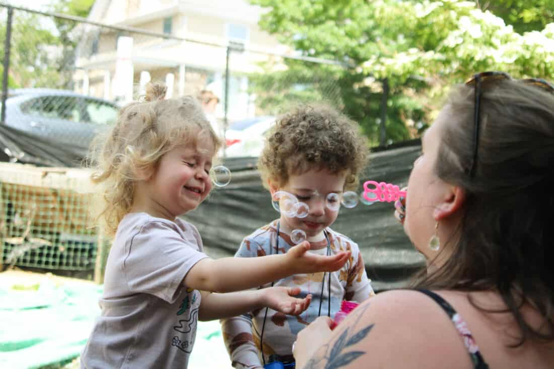 Brookline Early Learning Center with kids and teacher.