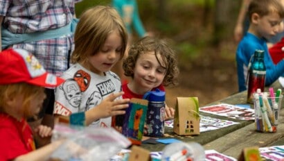 Girls working on art at Camp Grossman.