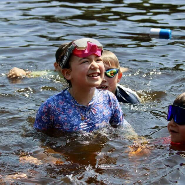 Girl swimming in the lake.