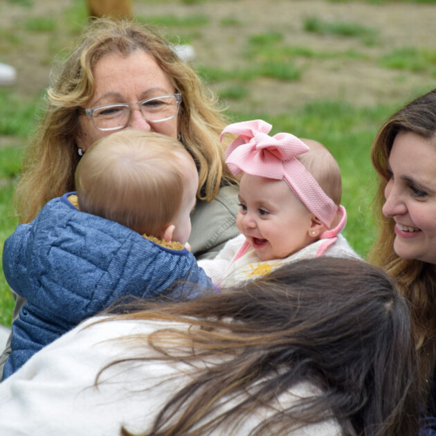 Babies at an outdoor Welcome Baby event.