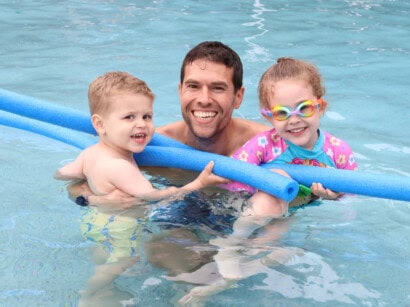 family enjoying the outdoor pool.