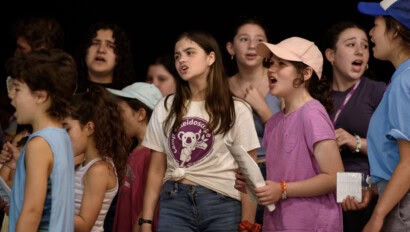 Girls performing on stage at Kaleidoscope.