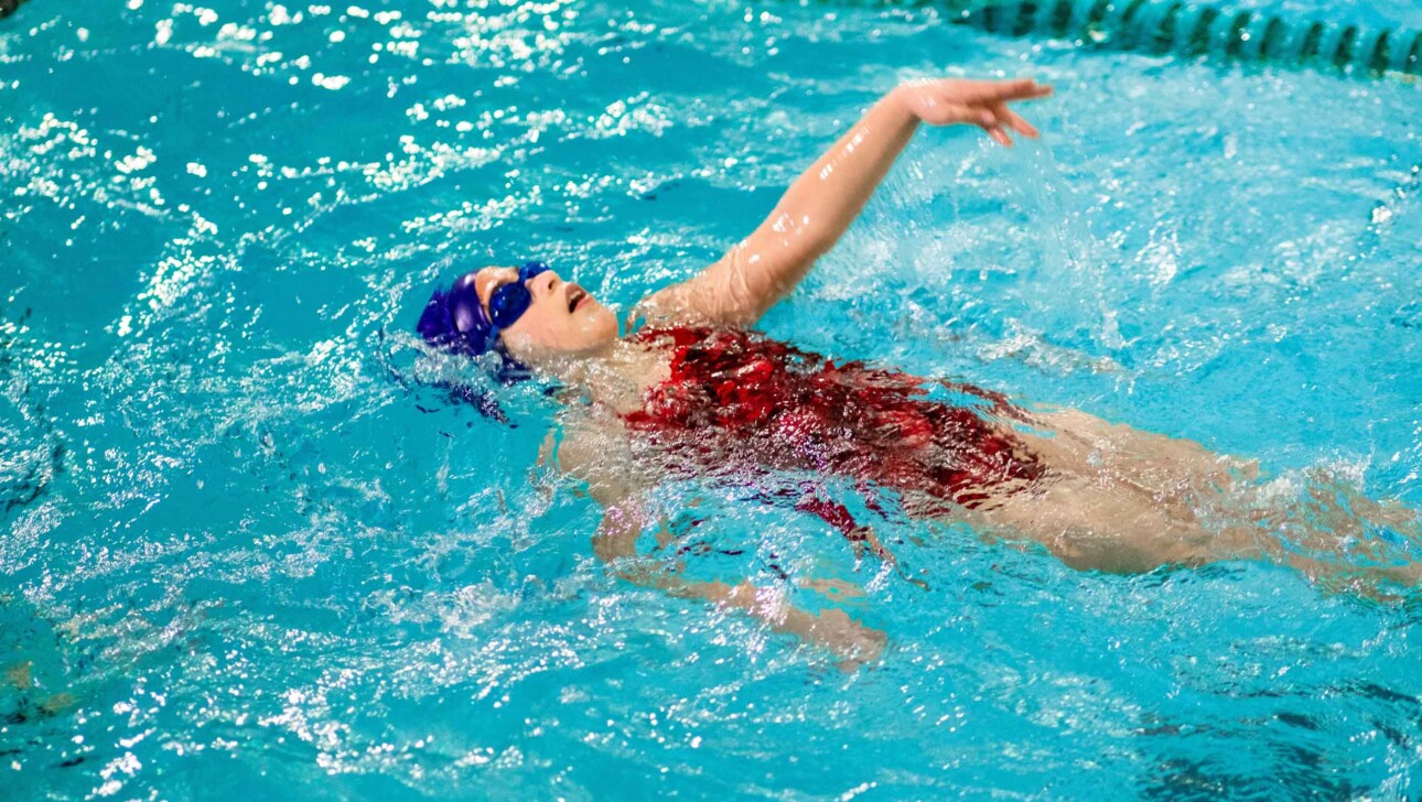 A camper swimming.