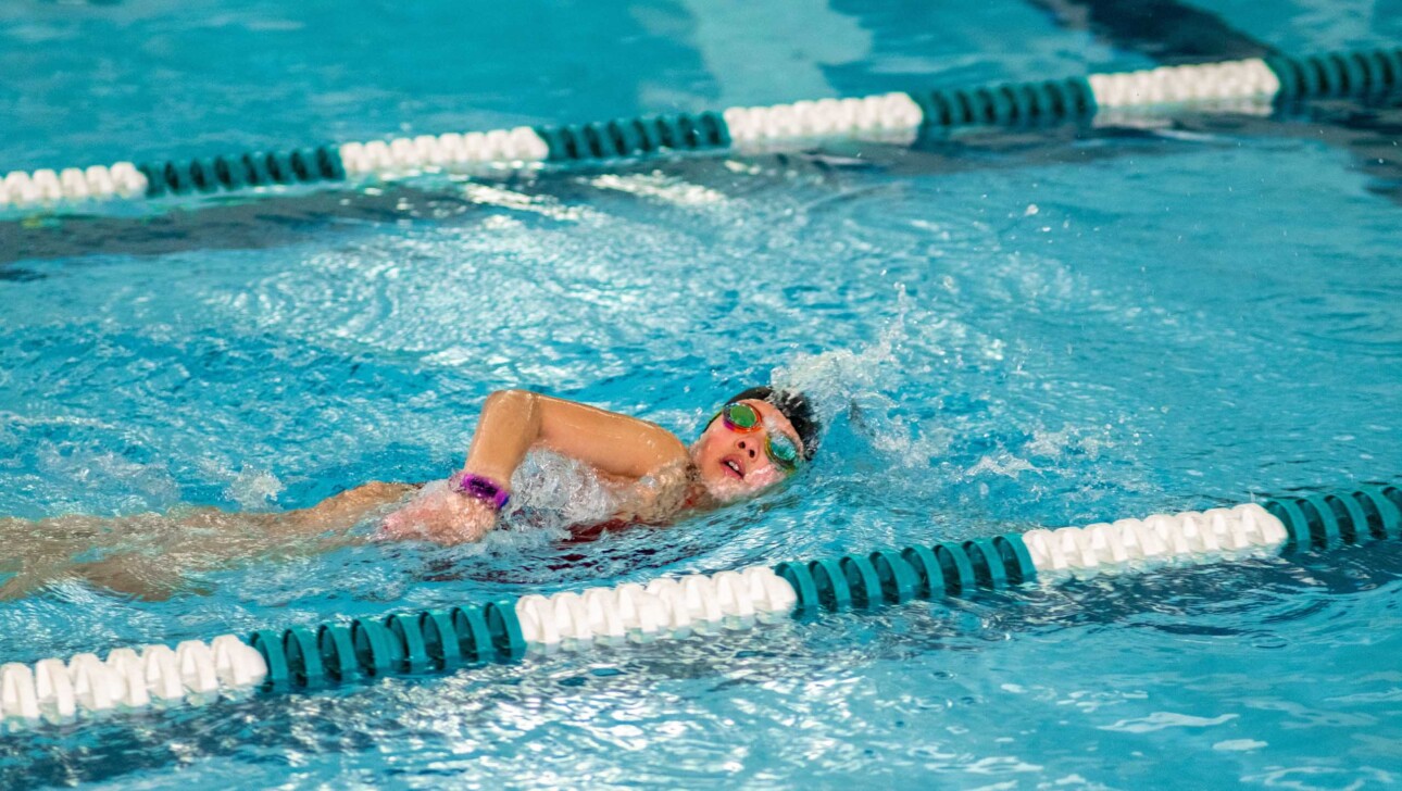A camper swimming.