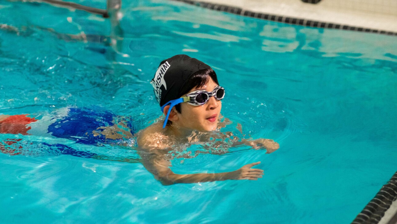 A camper swimming.