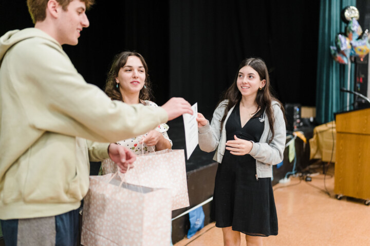 A girl receiving a gift.