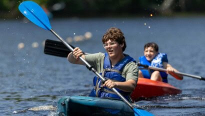 Kids kayaking at Camp Grossman.
