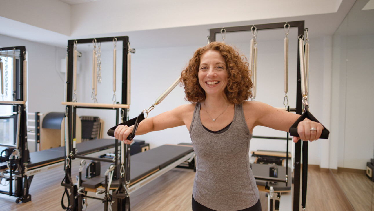 A woman practicing pilates.