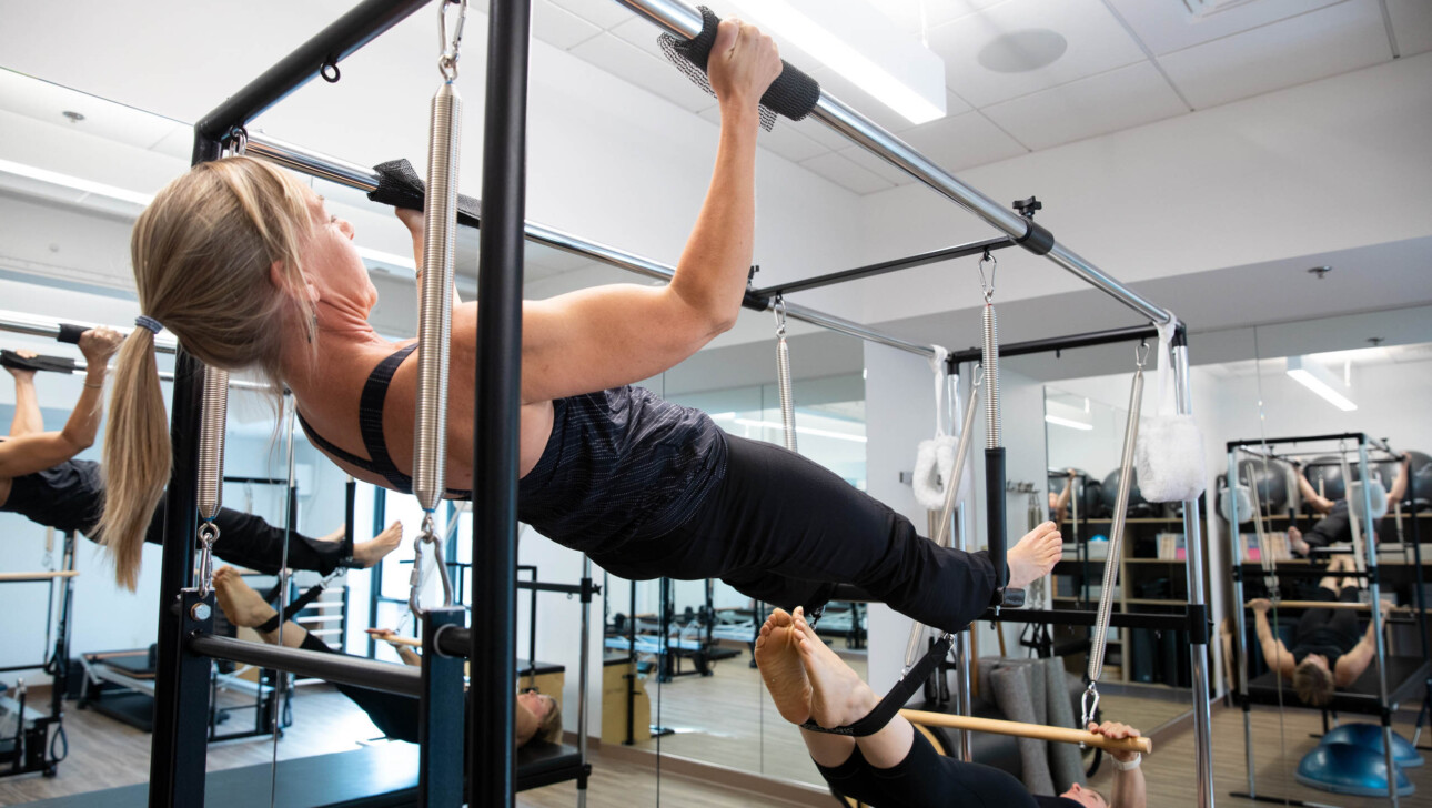 A woman practicing pilates.