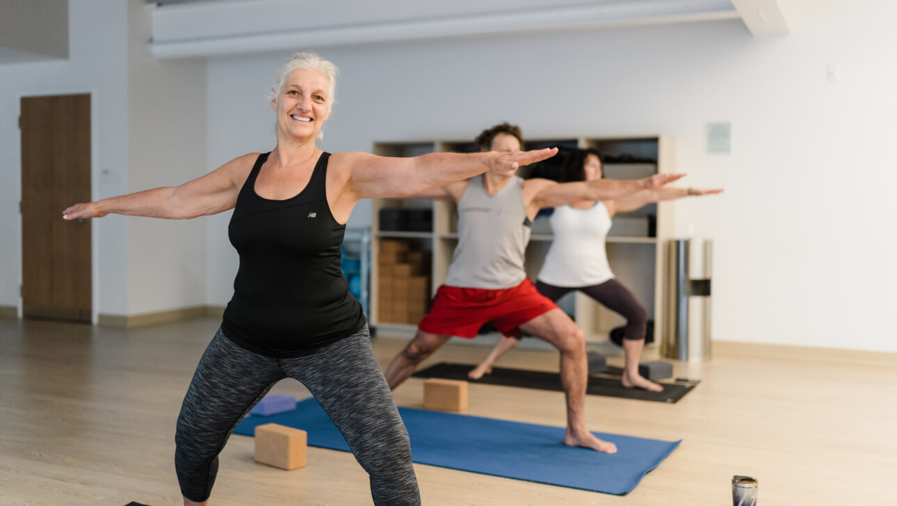 A group of adults practicing yoga.