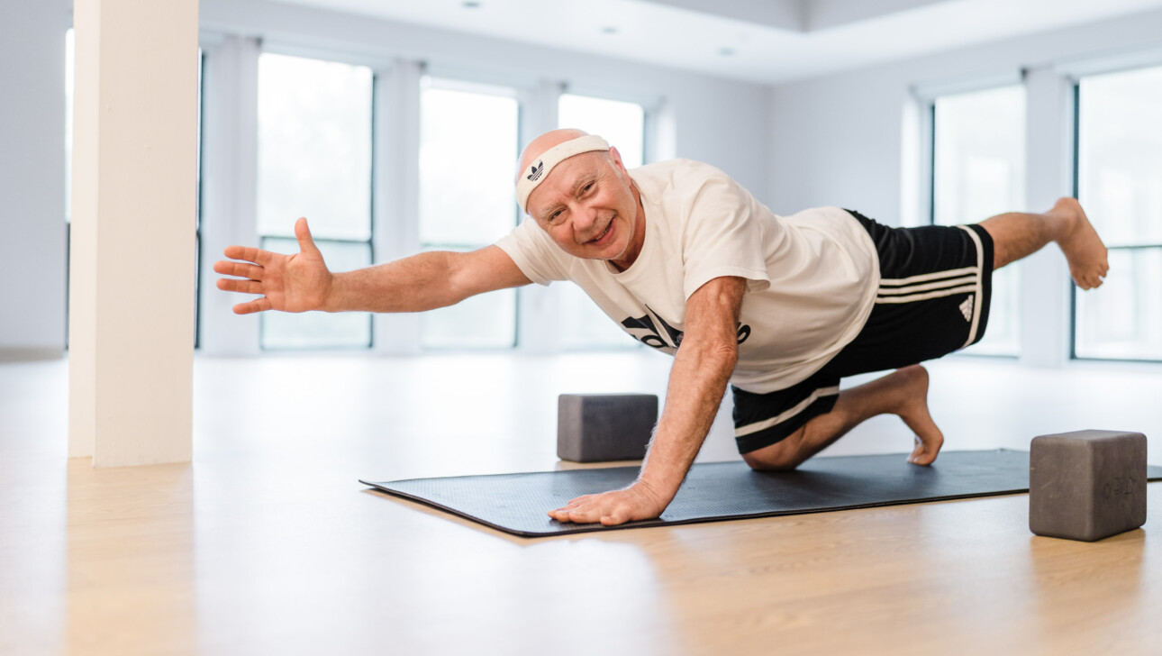 A man practicing yoga.