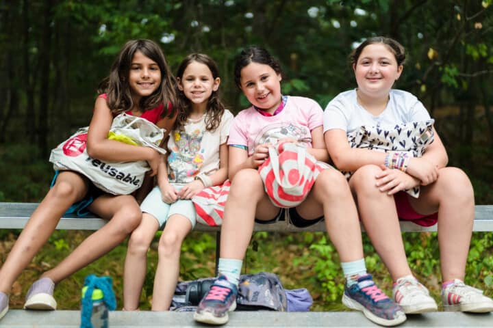 Girls smiling at Camp Grossman.