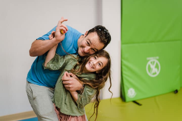 Dad hugging his daughter.