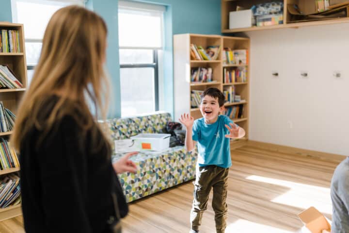 Little boy jumping for joy.