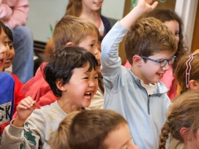 Kids smiling in Discovery Club.