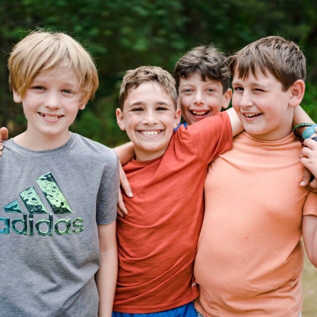 Boys smiling at camp.