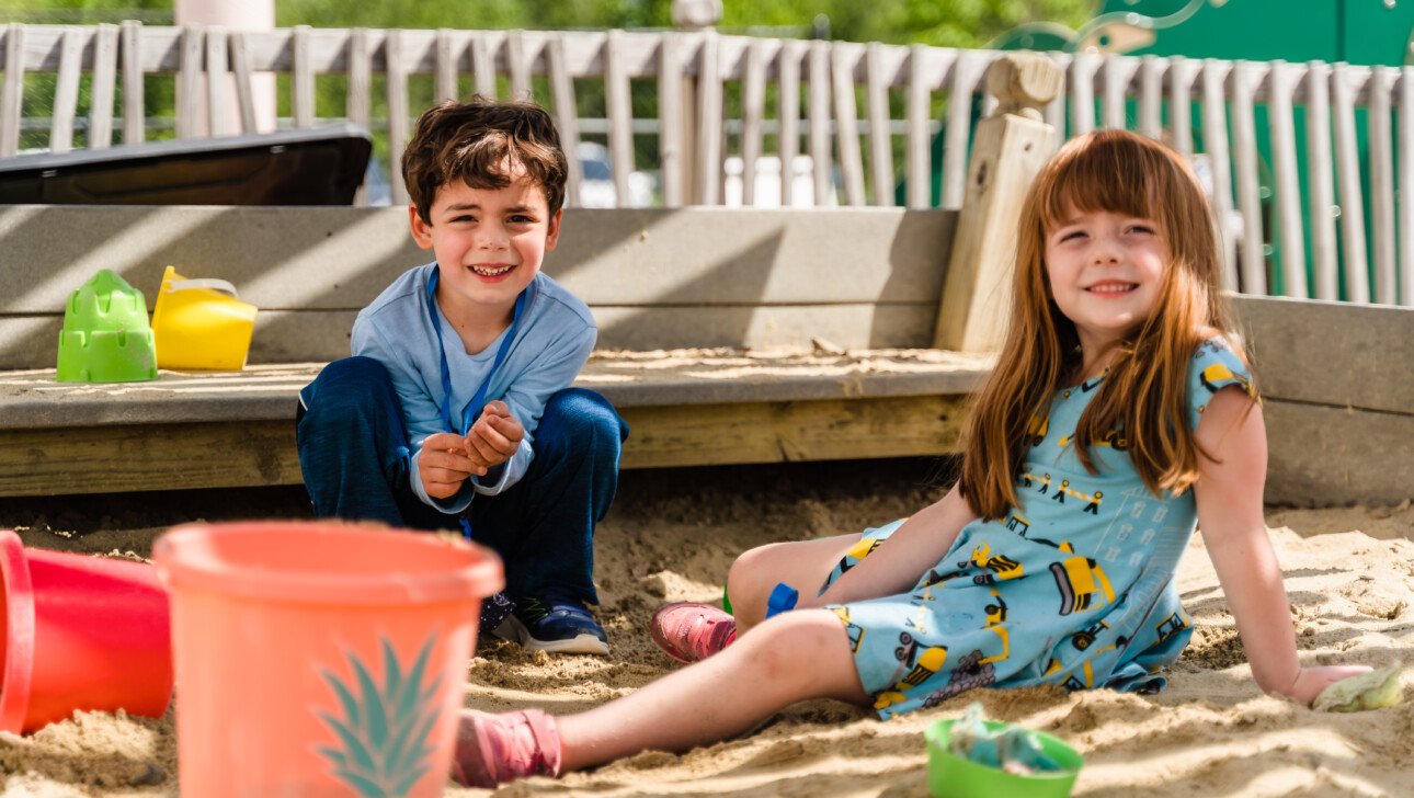 Kids playing in the sand.