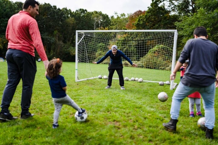 Kids playing soccer.