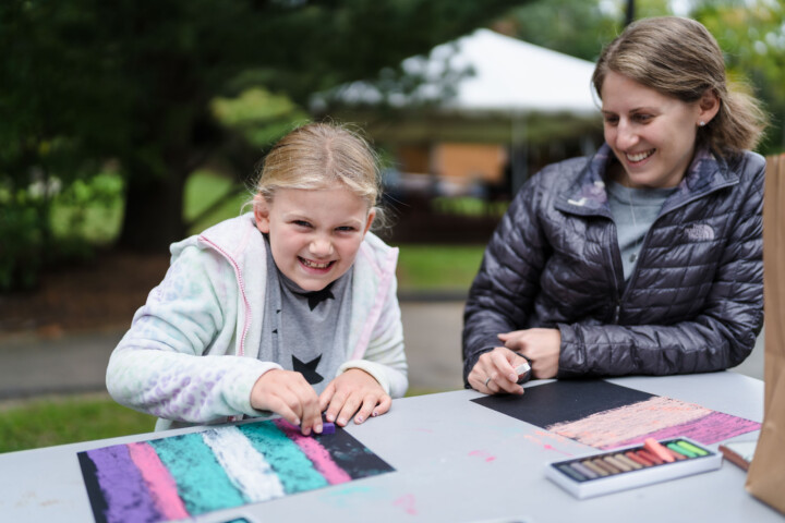 Girl doing pastel art.