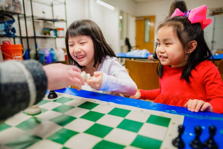 Girls playing chess.