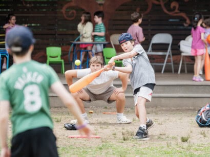 Kids playing baseball at Sports Camp.