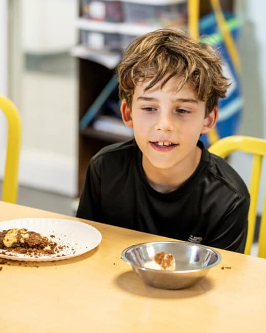 Boy with ingredients at Cooking Camp.