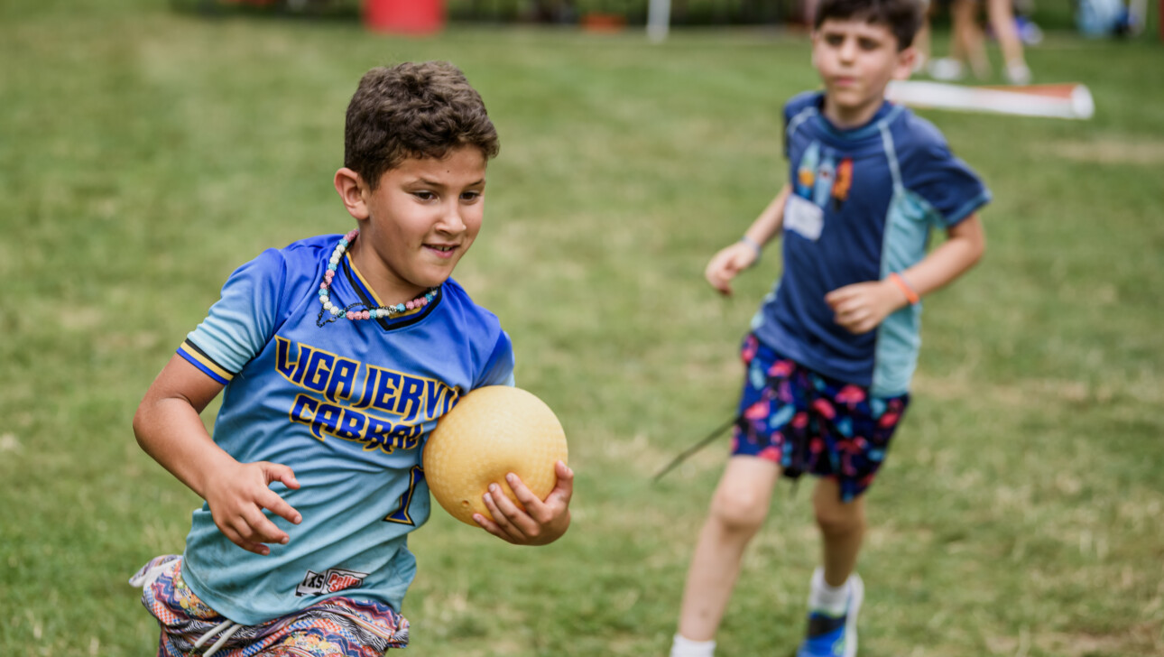 Boys playing outside at camp.