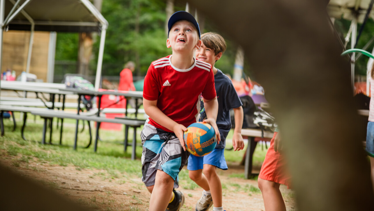 Kids playing outside at camp.