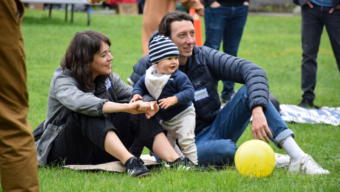 Welcome Baby family outside.